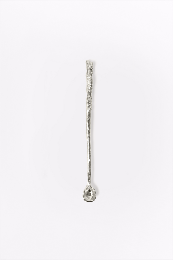 Silver spoon with textured handle on a white background