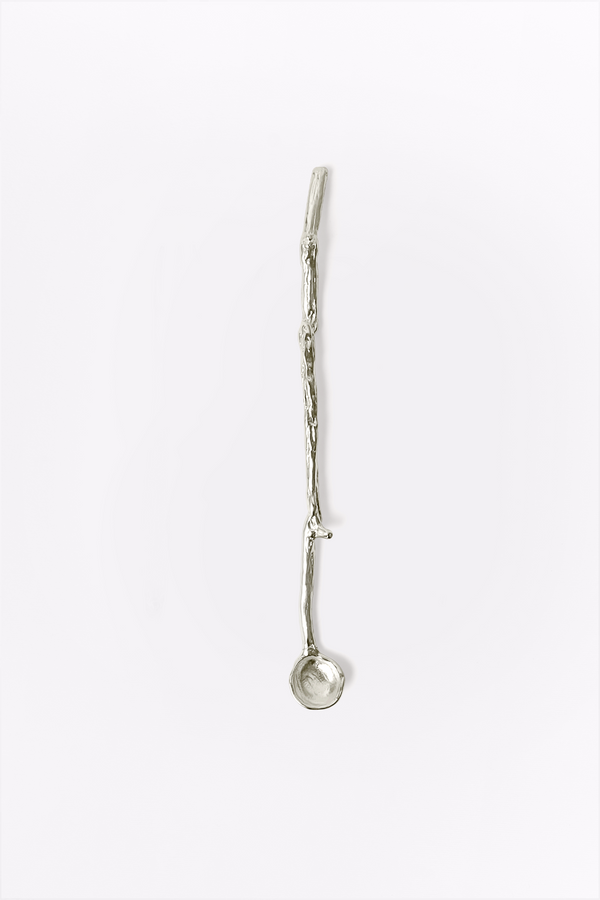 Silver spoon on a white background