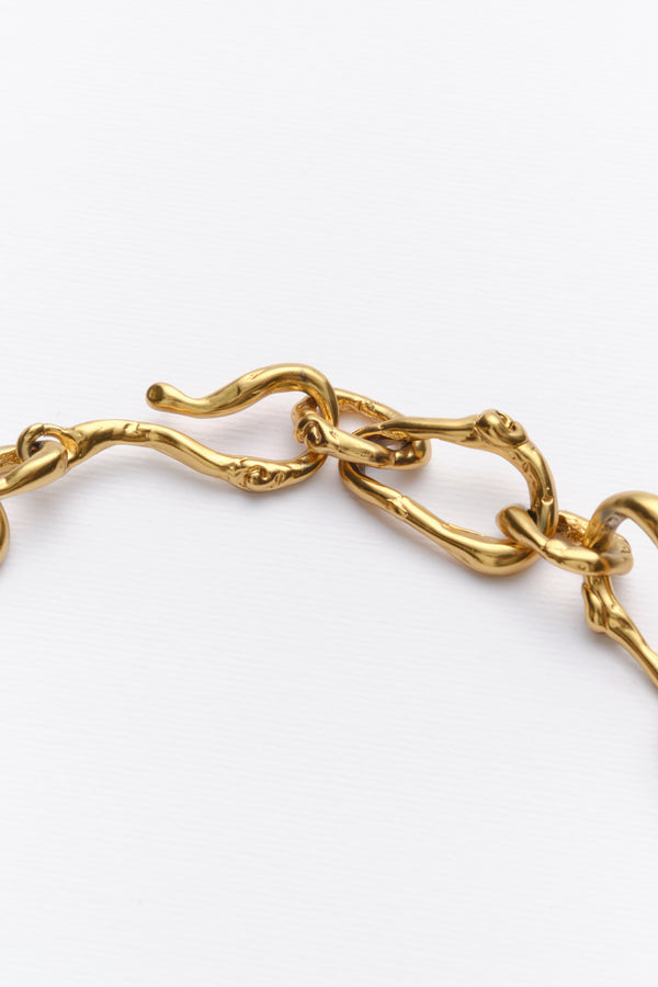 Gold sculptural chain bracelet link detail