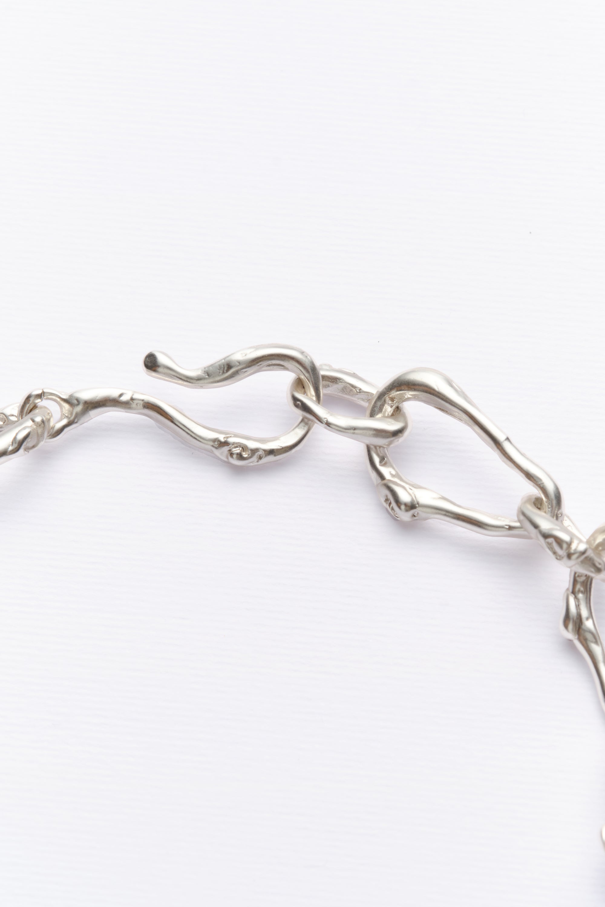 Silver sculptural chain bracelet link detail