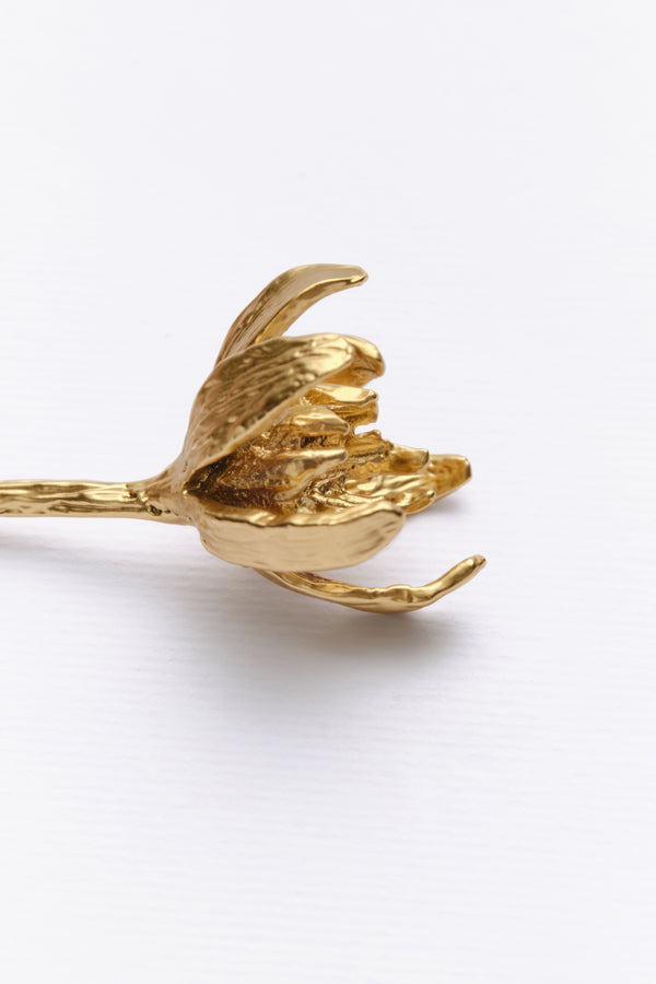 Gold sculptural flower bracelet detail side view