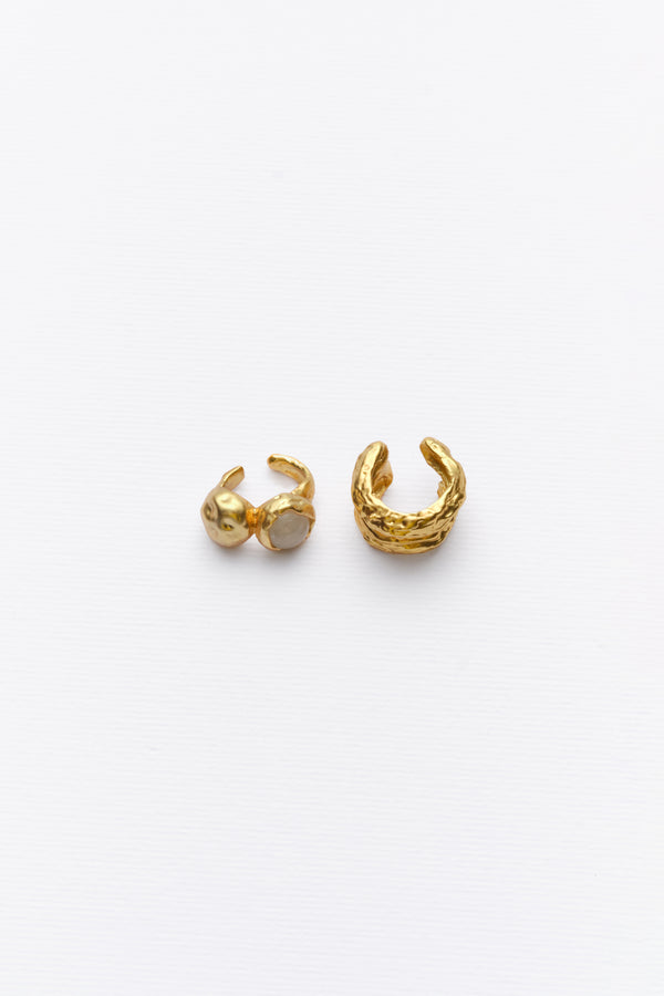 Gold sculptural ear cuff and stone ear cuff flat lay