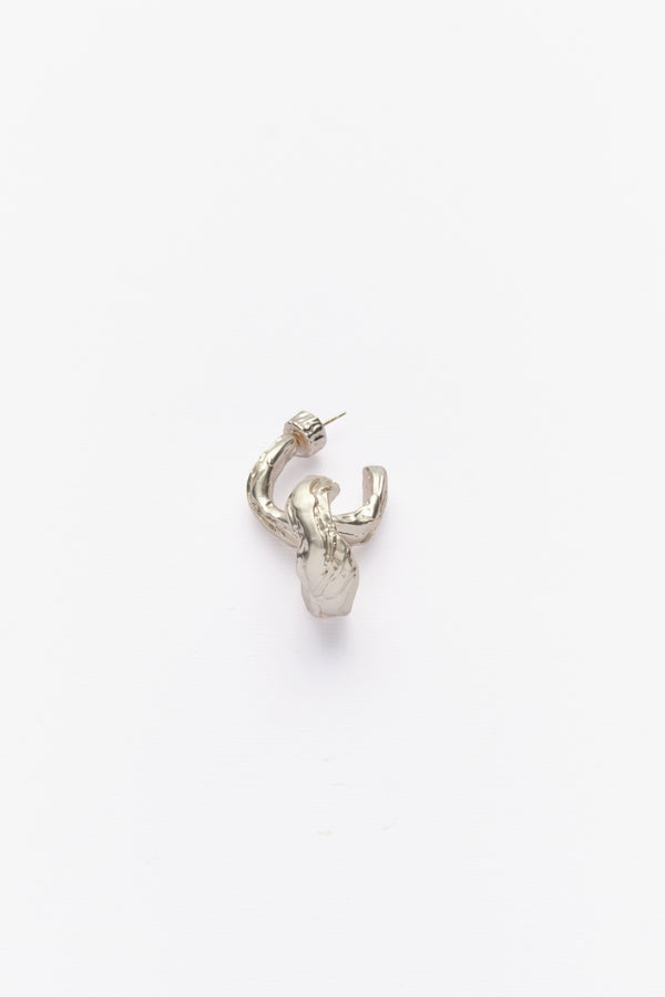 Silver sculptural organic hoop earring angled view