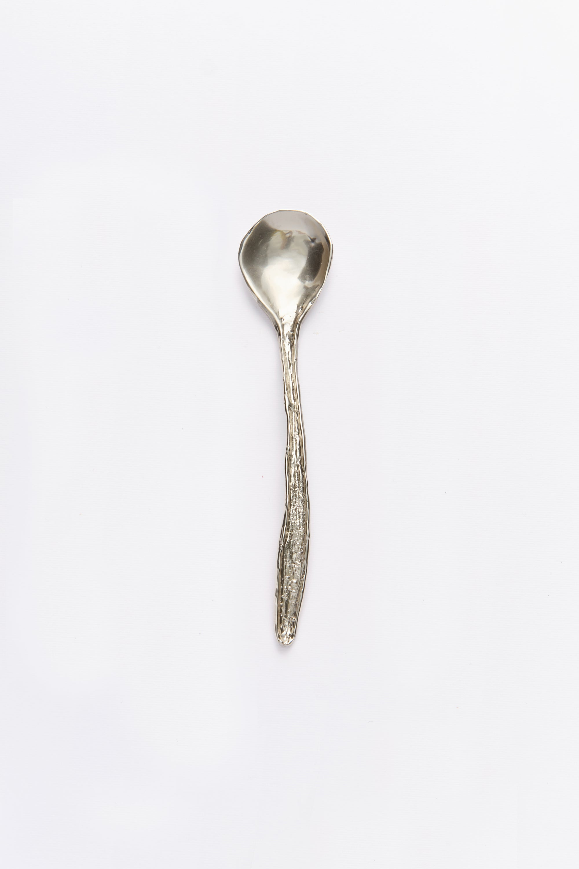 Silver spoon on a white background