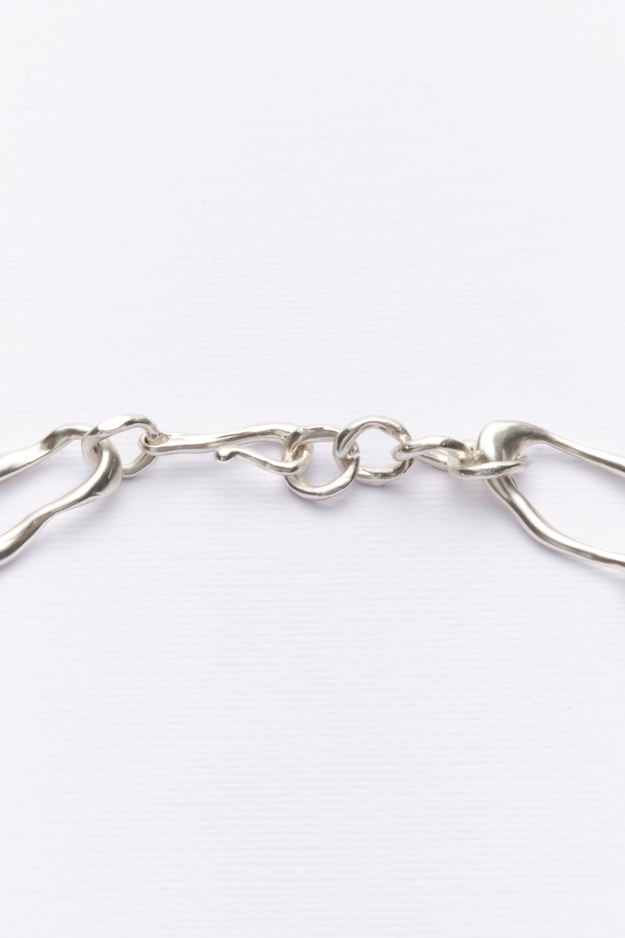 Silver sculptural chain necklace clasp detail
