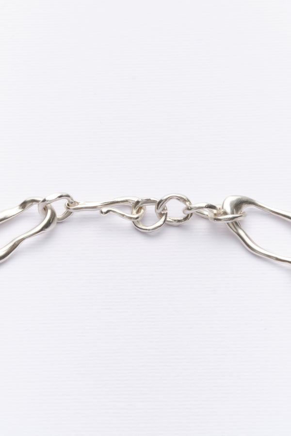 Silver sculptural chain necklace clasp detail