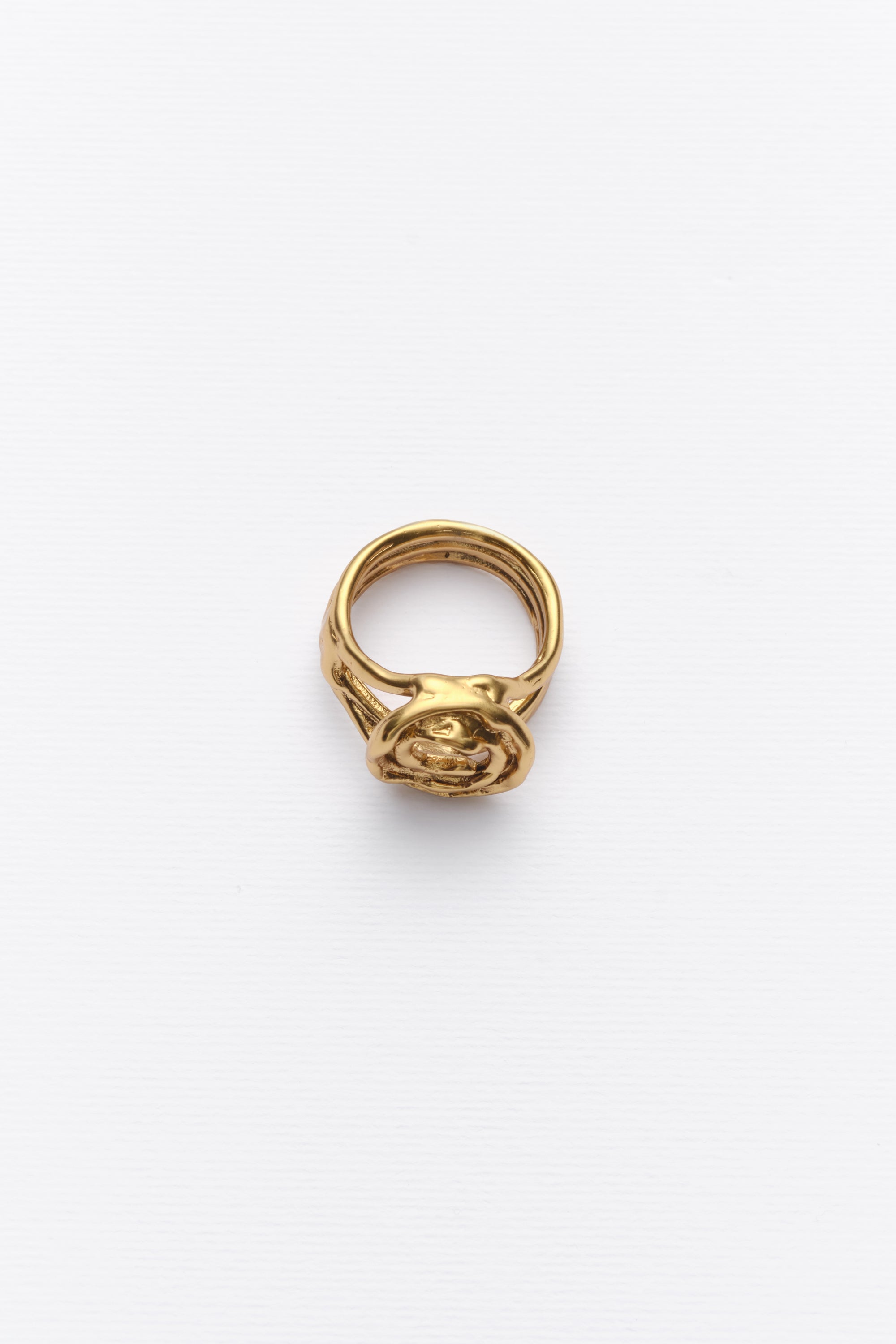 Gold sculptural spiral statement ring angled view