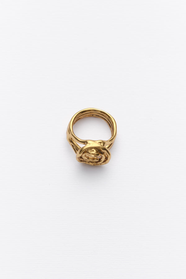 Gold sculptural spiral statement ring angled view