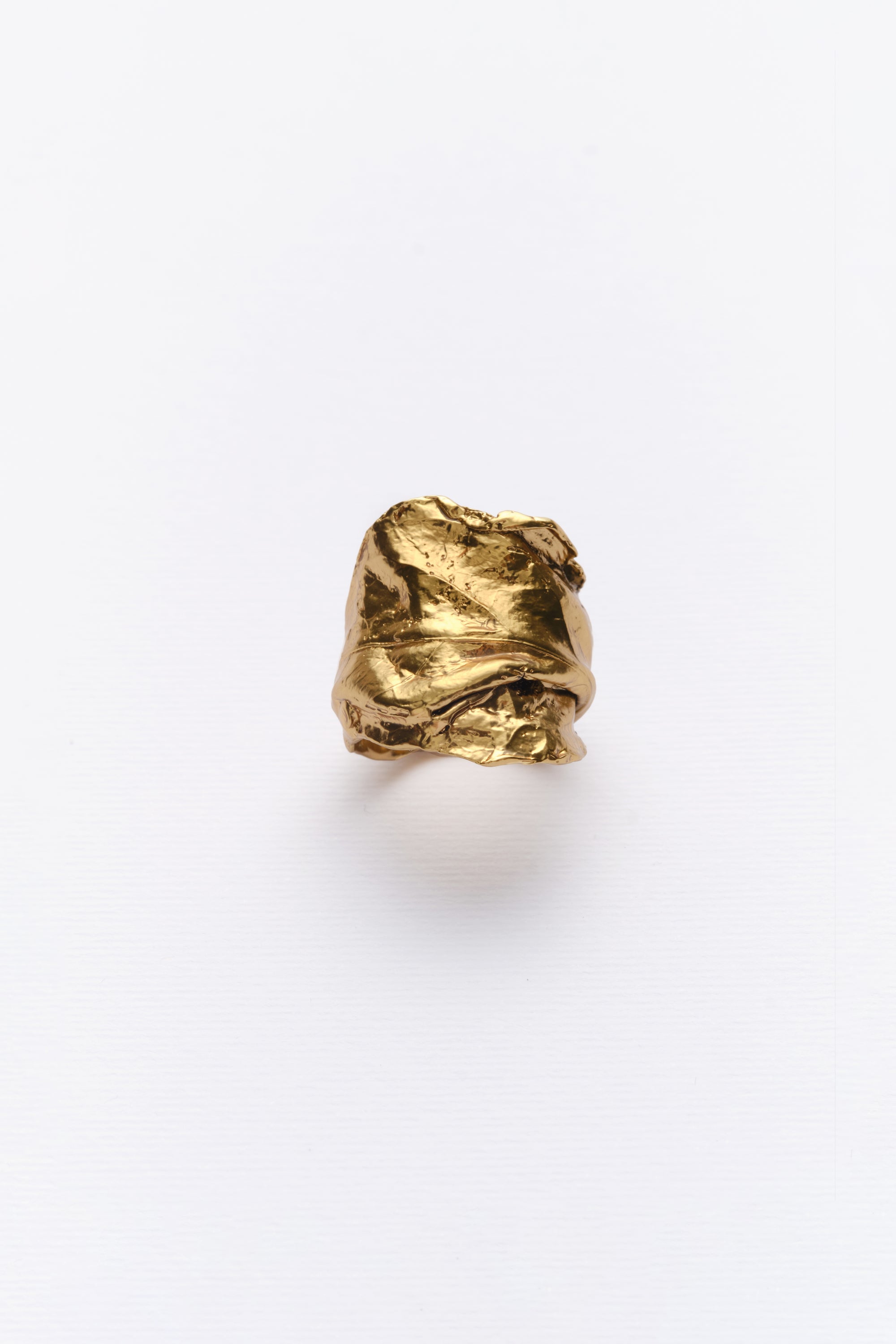 Gold sculptural textured statement ring angled view