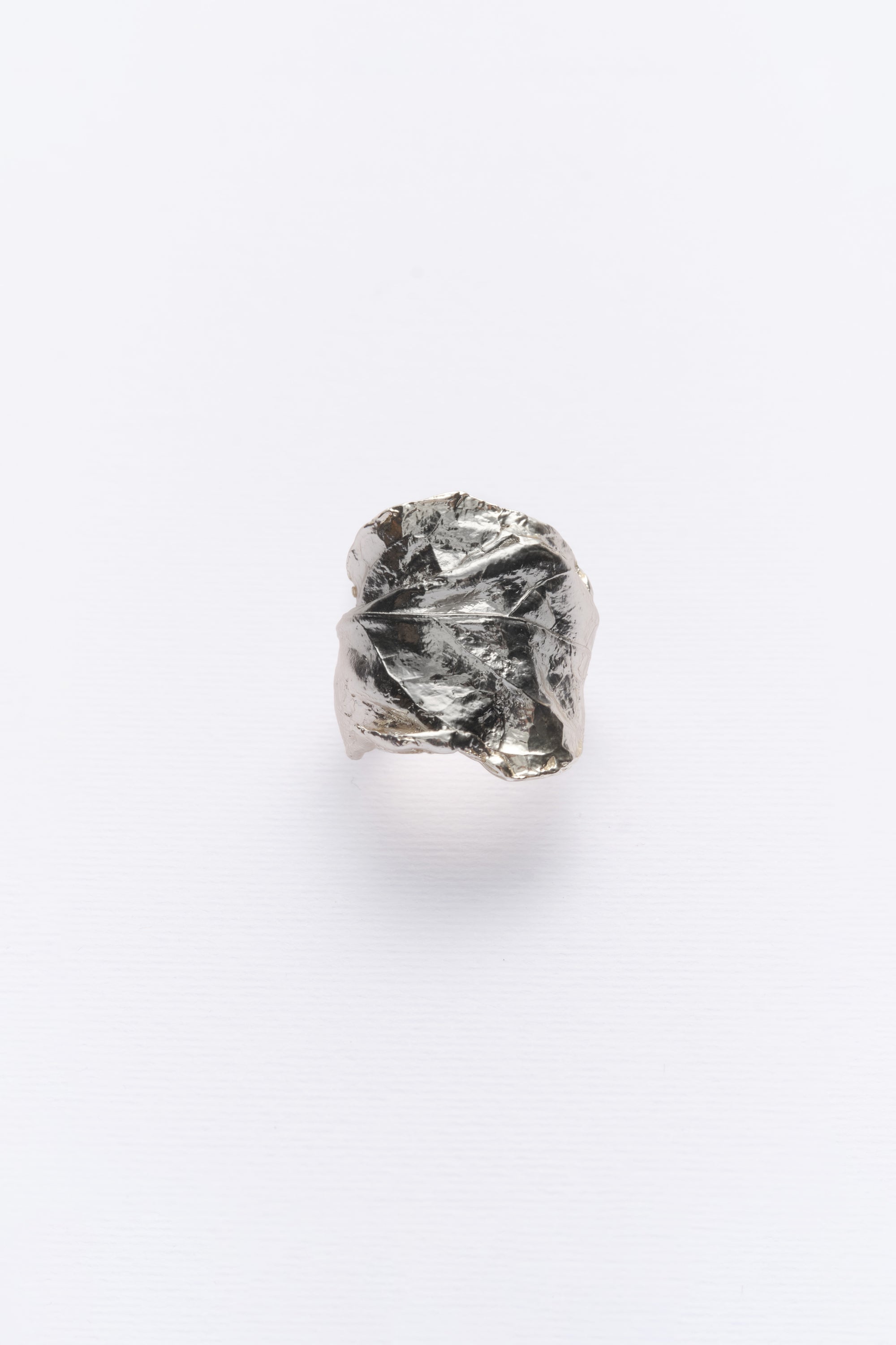 Silver sculptural textured statement ring angled view