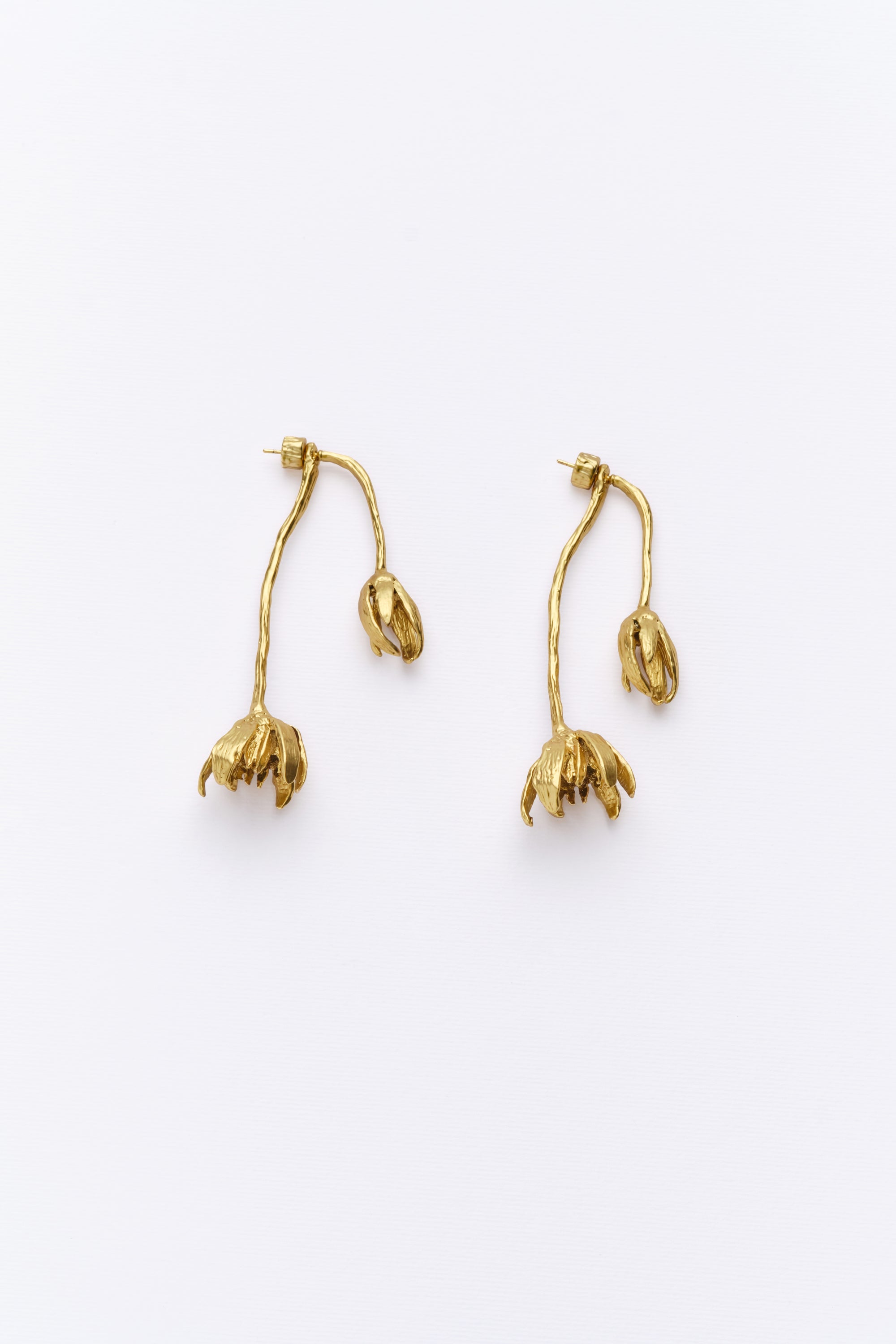 Pair of gold sculptural flower drop earrings front view