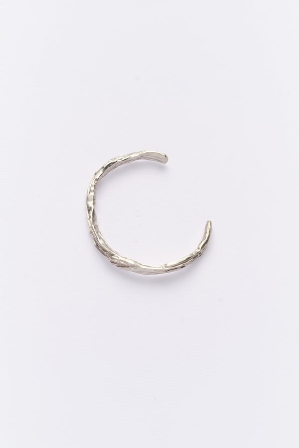 Silver organic open cuff bracelet flat lay