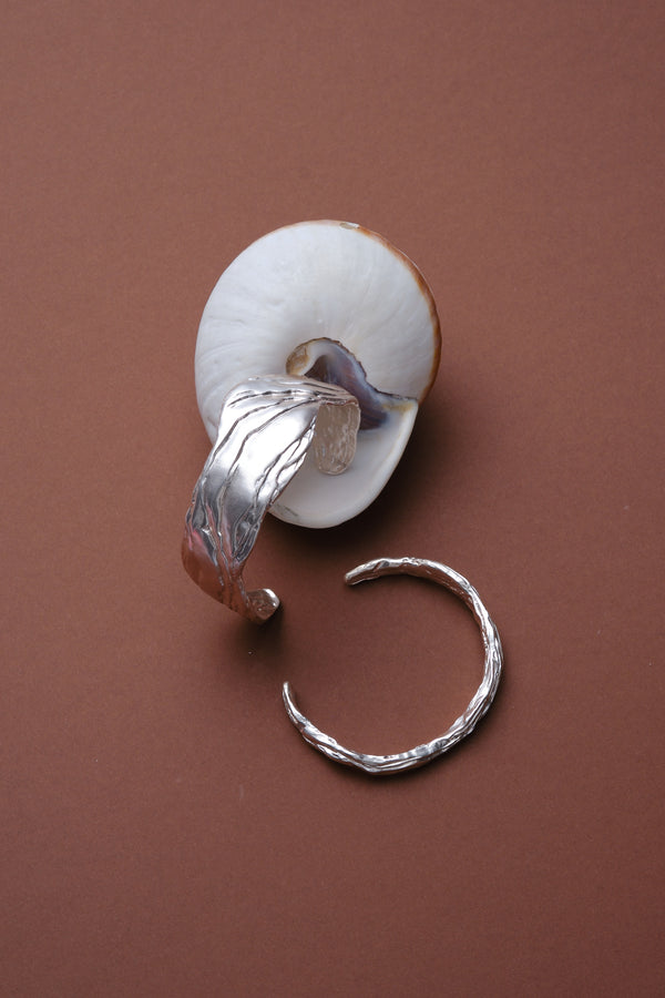 Silver sculptural cuff bracelet with shell styling