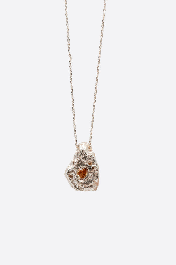 Silver textured organic pendant necklace with clear gemstone close-up