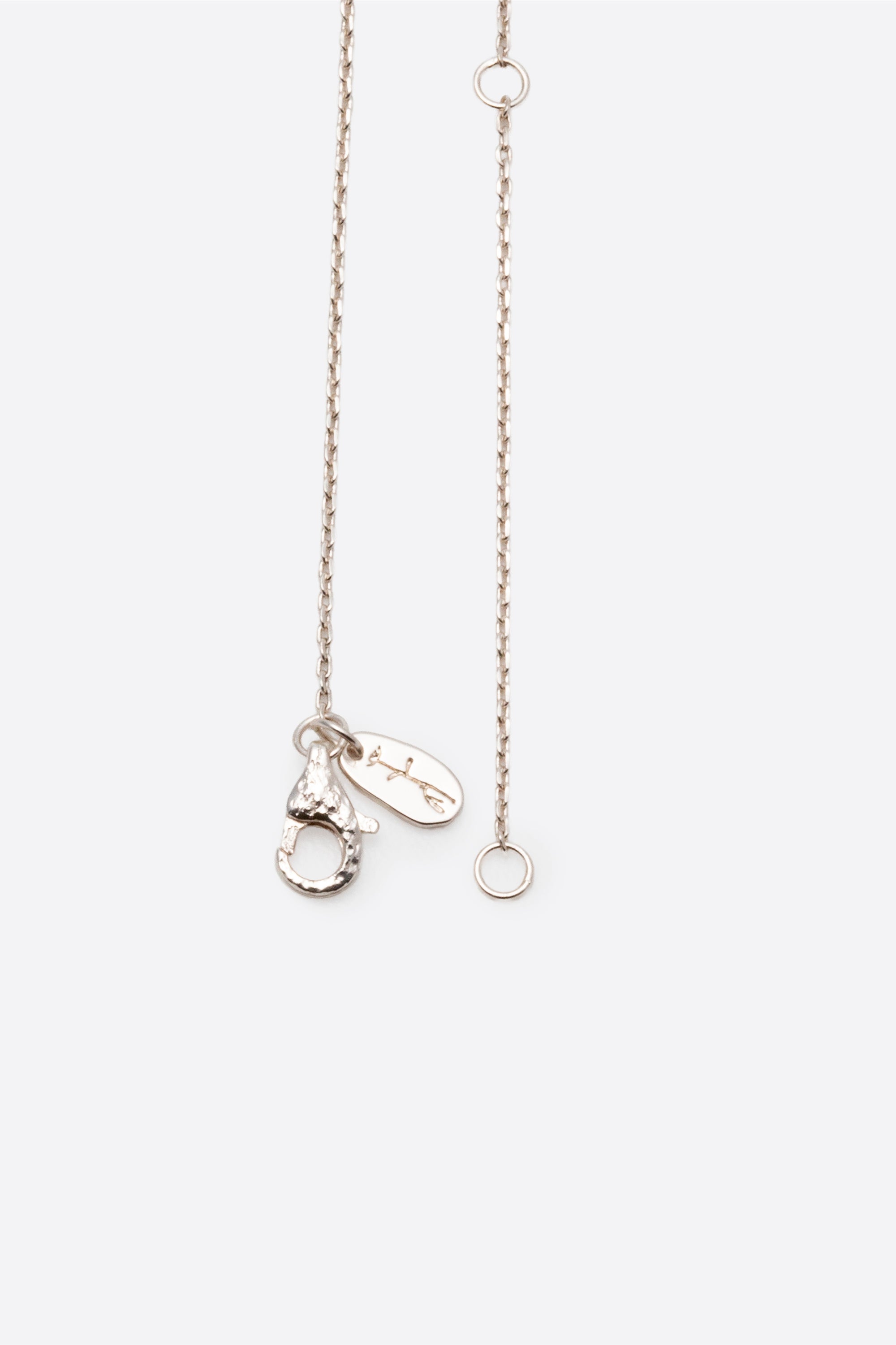 Adjustable silver chain clasp detail