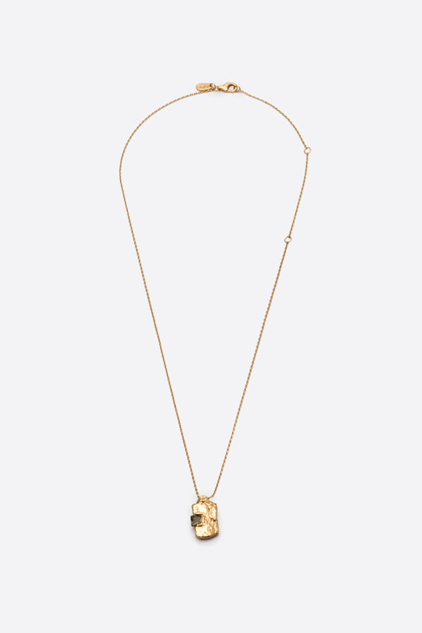 Gold textured rectangular pendant necklace with square dark gemstone flat lay