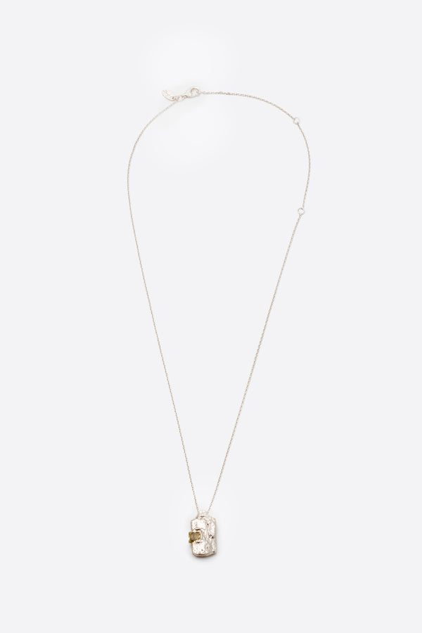 Silver textured rectangular pendant necklace with square yellow gemstone flat lay