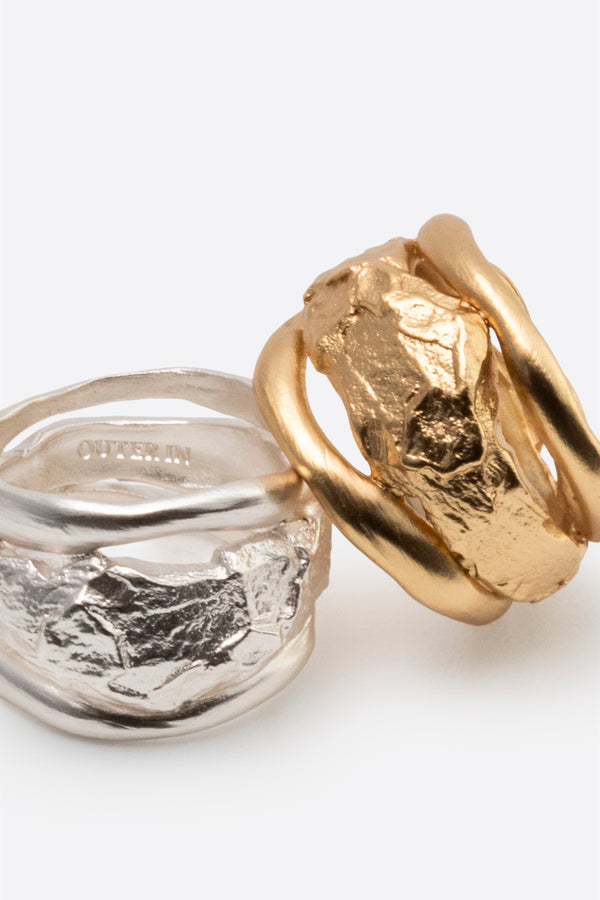 Gold and silver sculptural statement rings with organic texture