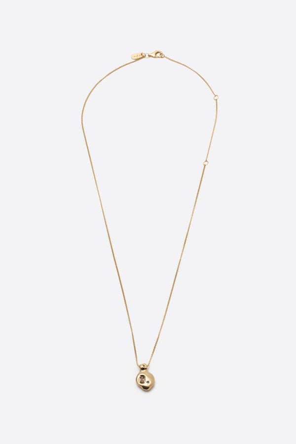 Long gold pendant necklace with sculptural gemstone charm on fine chain