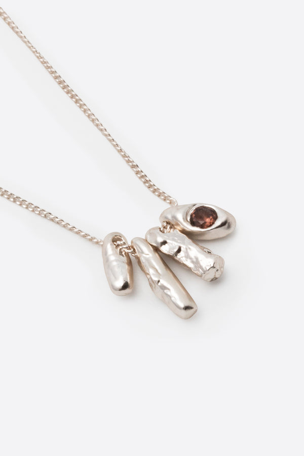 Silver gemstone pendant necklace with organic sculptural charm