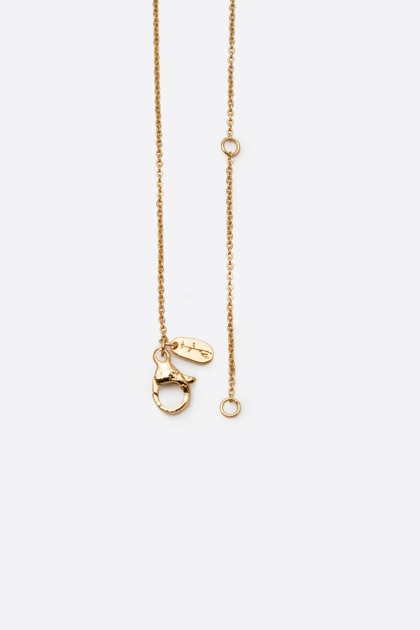 Gold pendant necklace showing adjustable chain and clasp detail