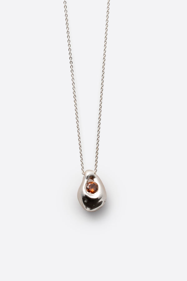 Silver gemstone pendant necklace with organic sculptural pendant