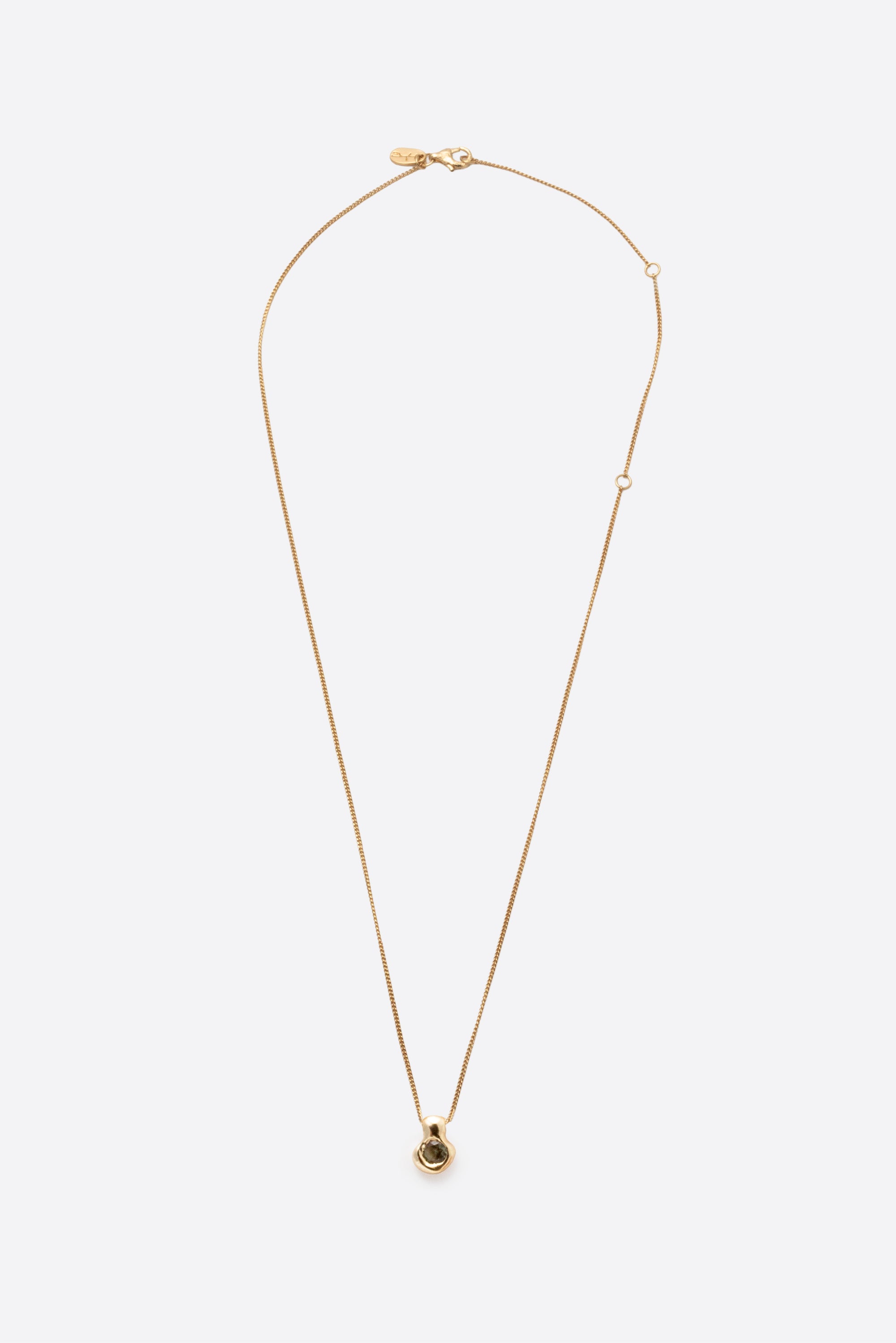 Gold gemstone pendant necklace with organic sculptural pendant