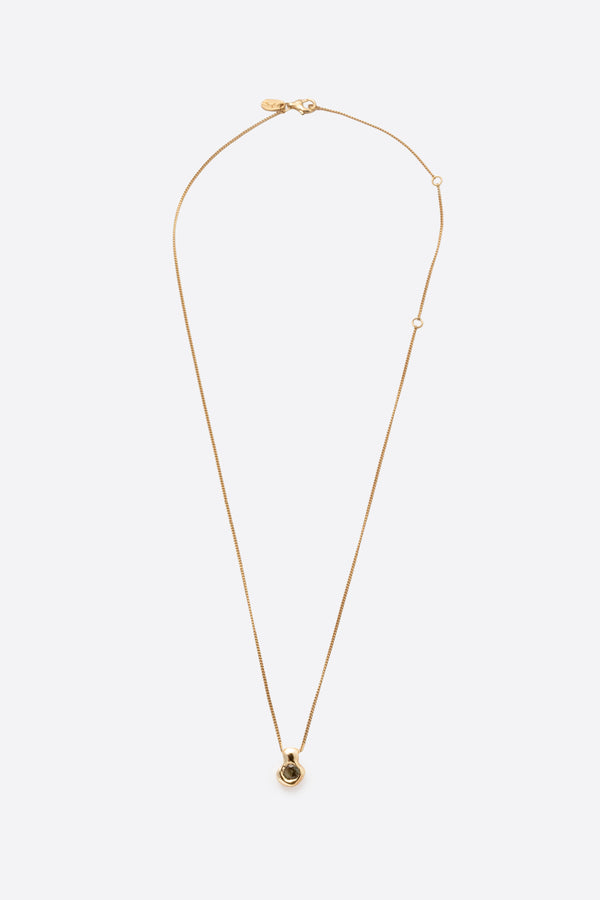 Gold gemstone pendant necklace with organic sculptural pendant