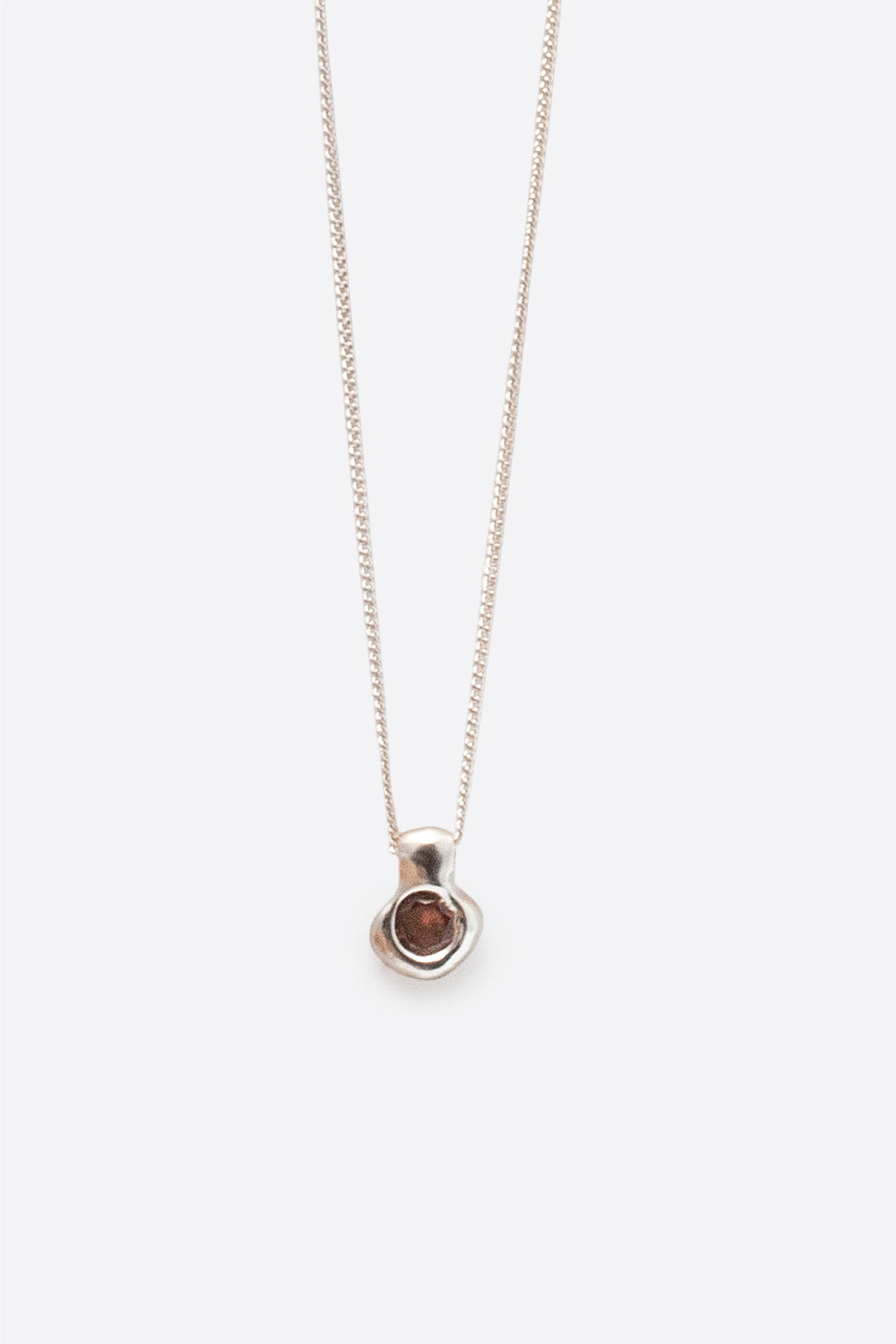 Silver gemstone pendant necklace with organic sculptural pendant