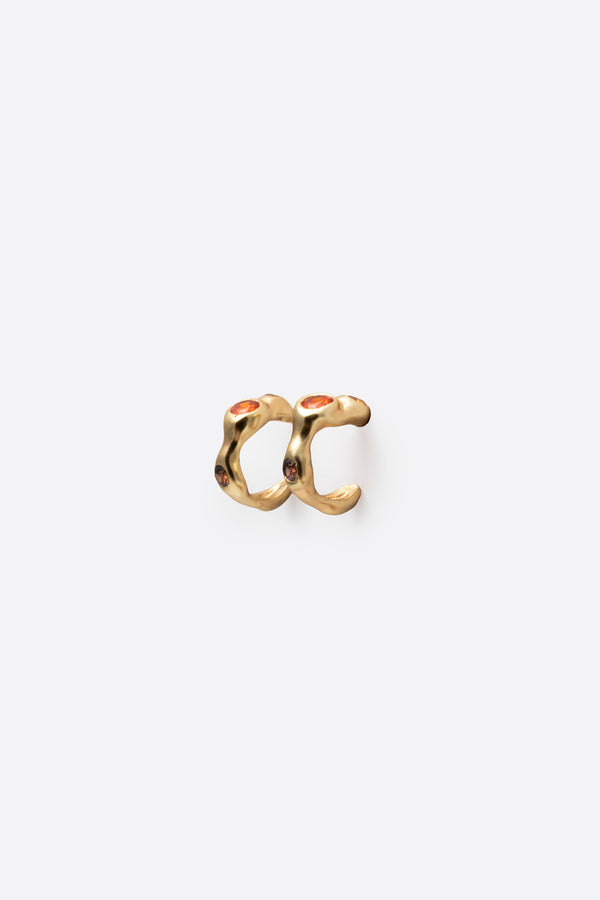 Back view of gold gemstone huggie earrings with sculptural design