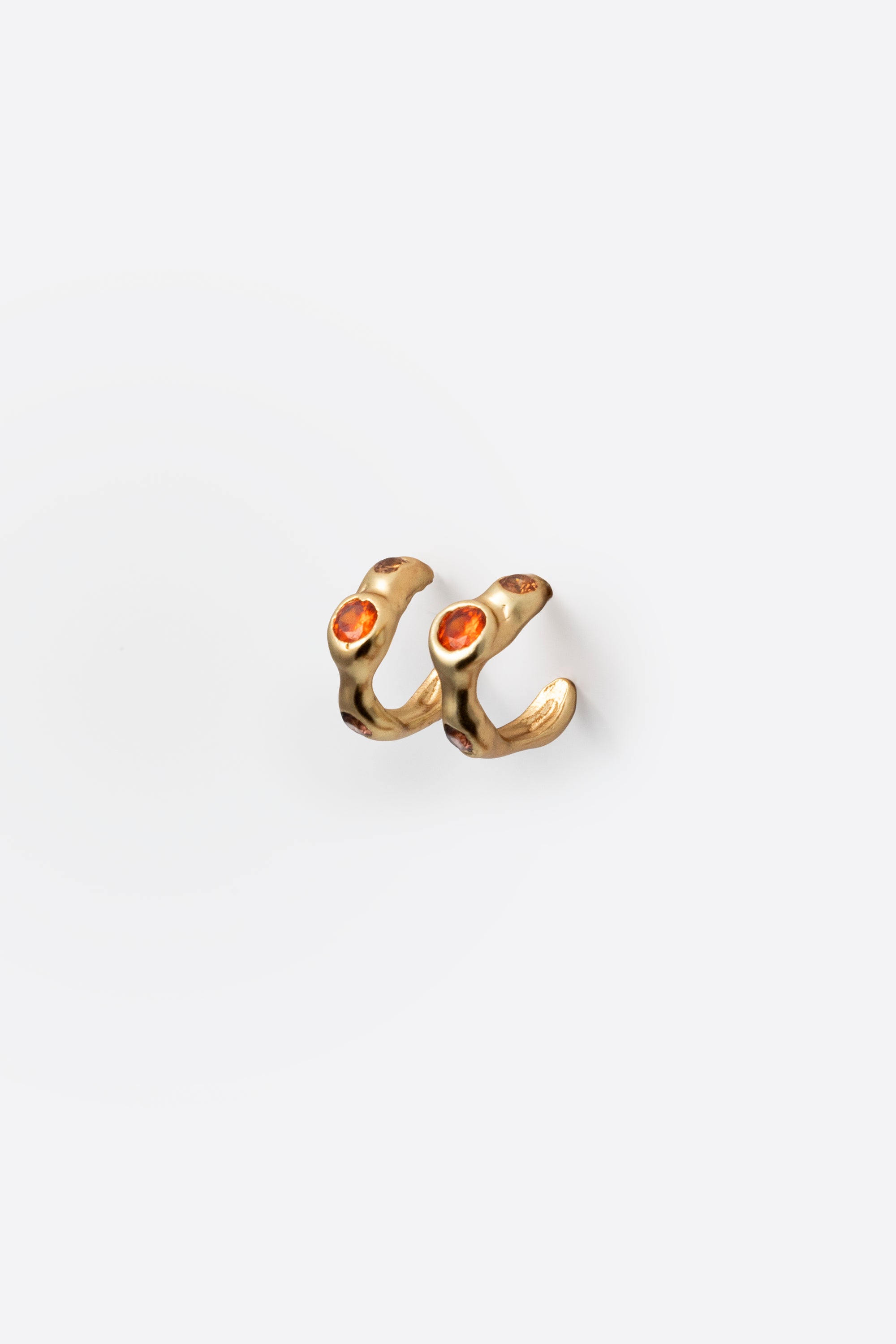 Gold gemstone huggie earrings with sculptural organic setting