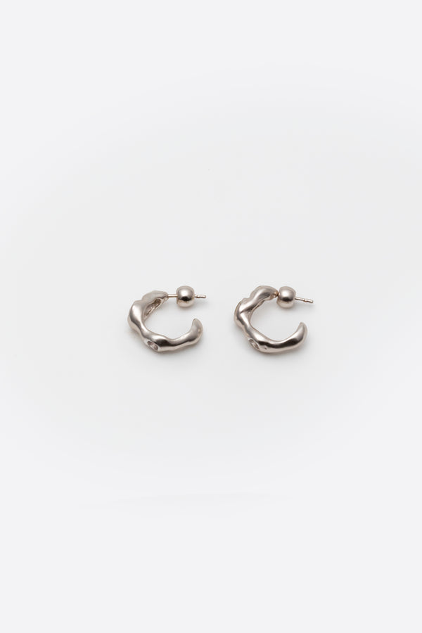 Side view of sculptural sterling silver gemstone huggie earrings