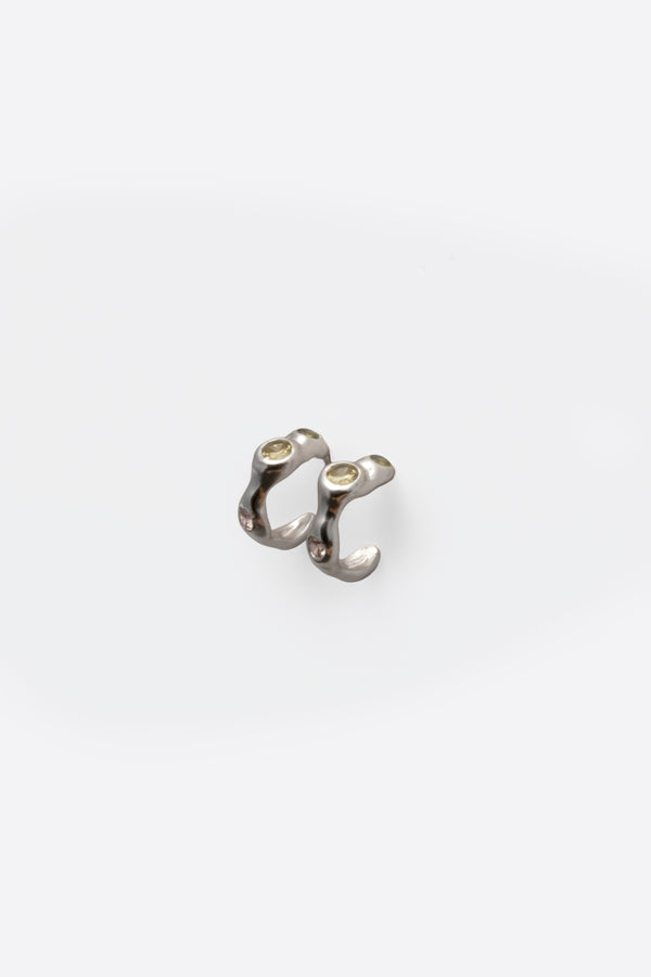 Back view of sterling silver gemstone huggie earrings with organic design