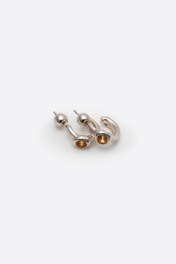 Side view of sculptural sterling silver gemstone stud earrings