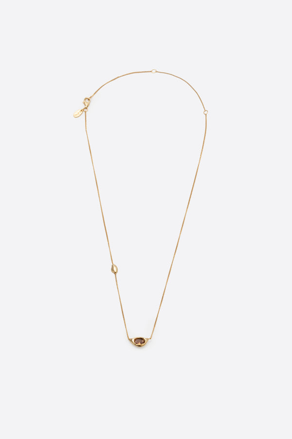 Gold gemstone pendant necklace with sculptural organic pendant