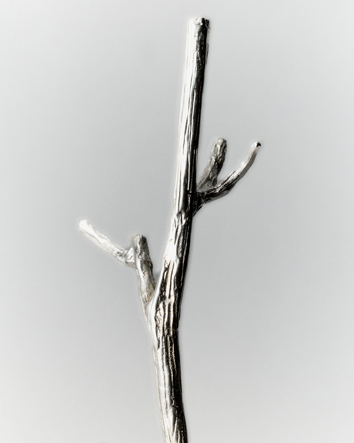 Autumn Stirring Stick Set of 4 in silver: close-up of a forked branch-shaped stirring stick.