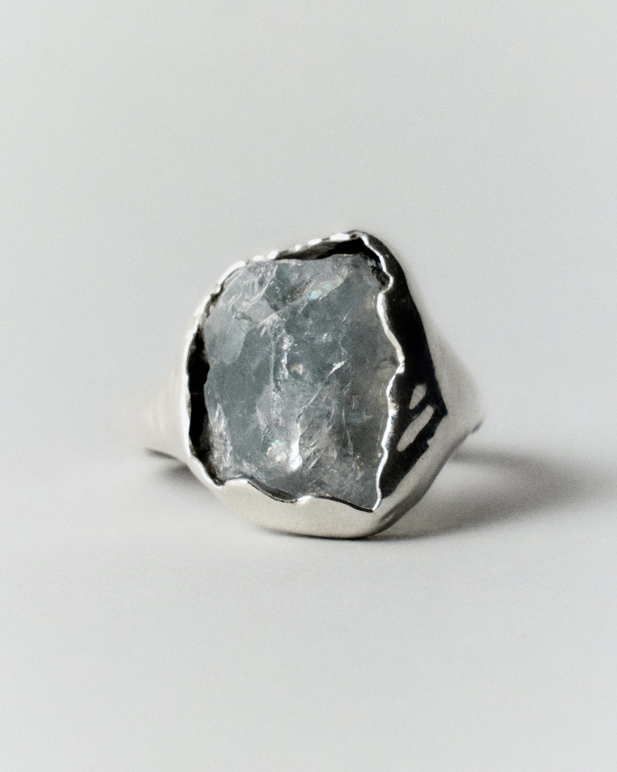 Celestite Ring in silver: front view of the pale blue rough stone.