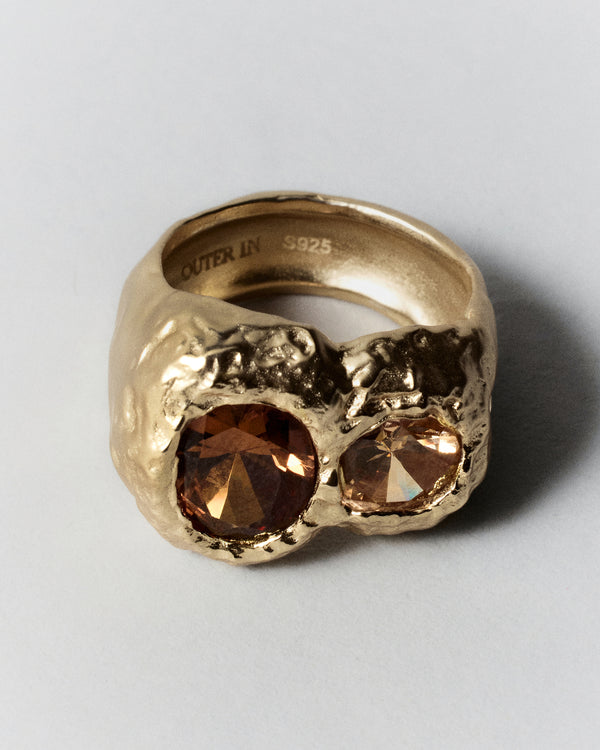 Cocoon Ring in gold: angled view of the ring's clustered warm-colored stones.