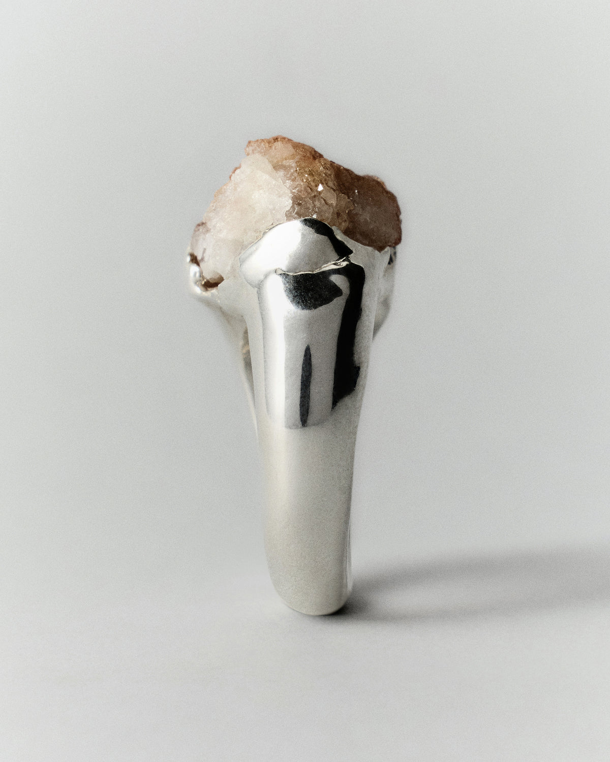 Cosmos Citrino Ring in silver: side view showing the raised rough stone and smooth band.