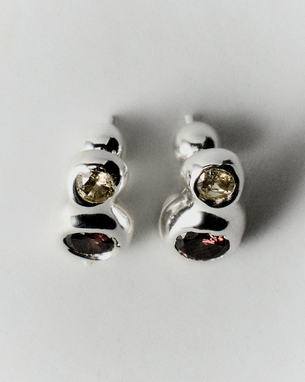 Double Pepita Studs Earrings in silver: reverse view showing the double-stone studs' rounded settings.