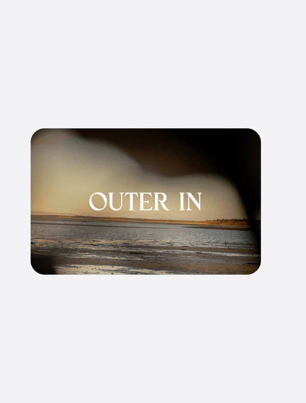 Outer In gift card with a warm sunset landscape.