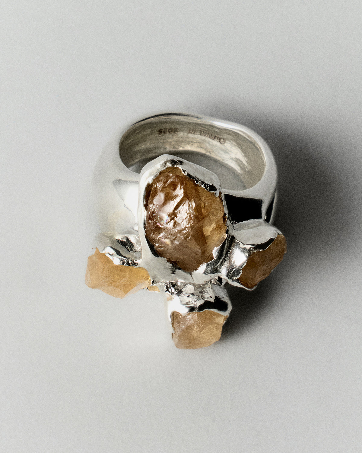 Gran Citrino Ring in silver: reverse angled view showing the broad ring band and raised stones.
