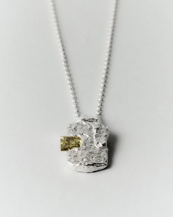 Nova Necklace in silver: closer view of the textured pendant and projecting stone.