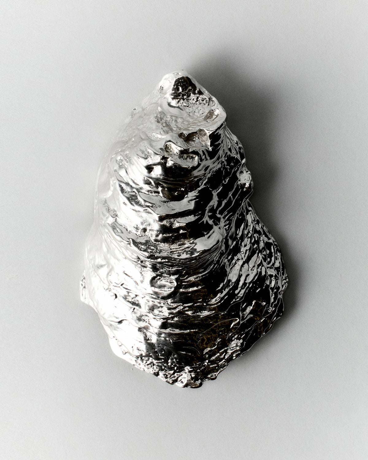 Oyster Incense Holder in silver: textured oyster shell holder shown upright.