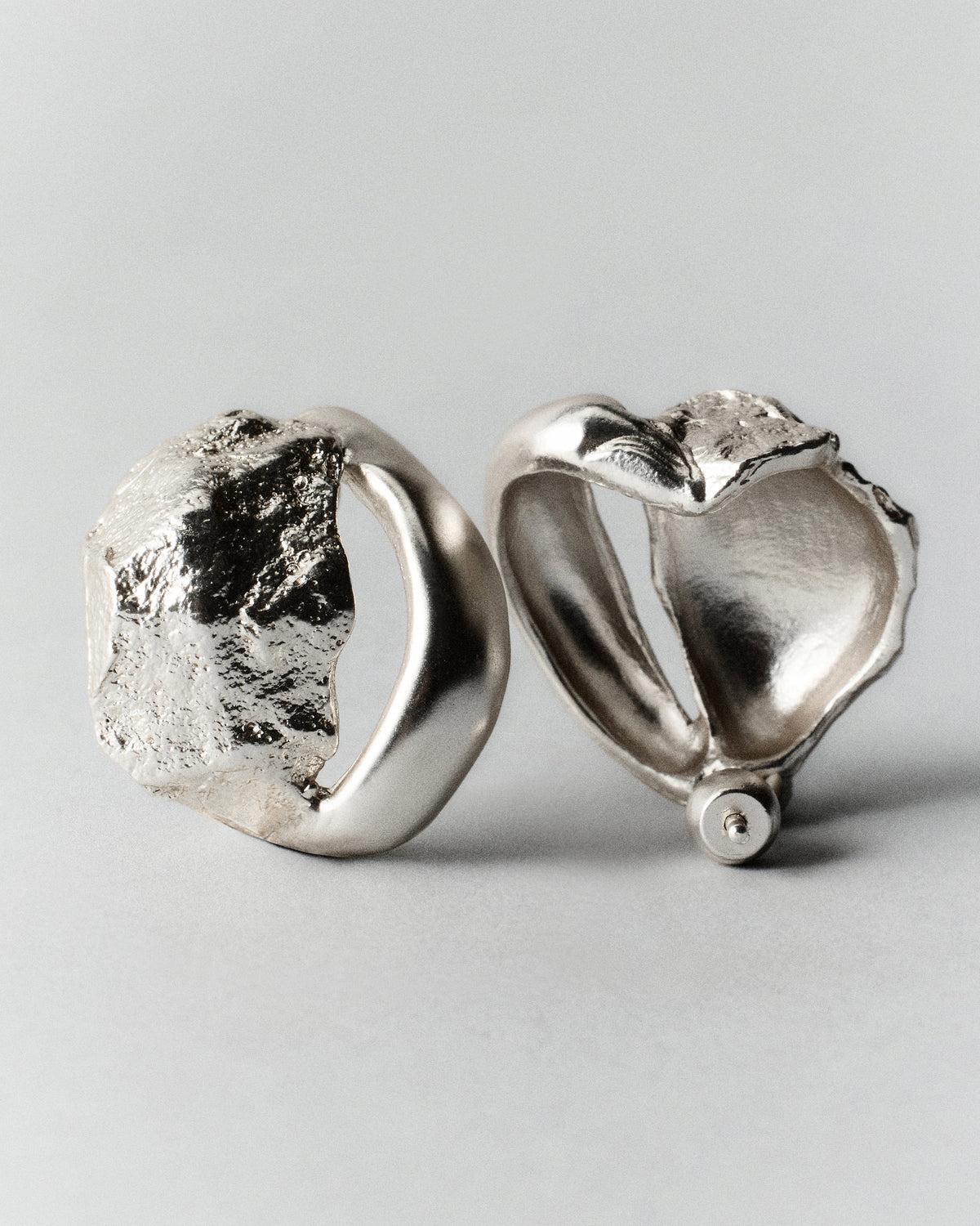 Rio Earrings in silver: front and reverse views of sculptural textured earrings.