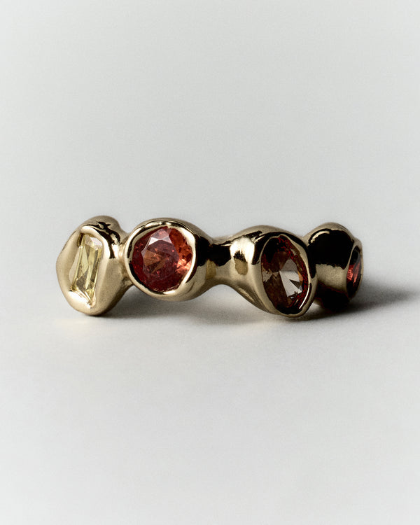 Sunset Pepita Ring in gold: front view of the ring's three rounded stone settings.