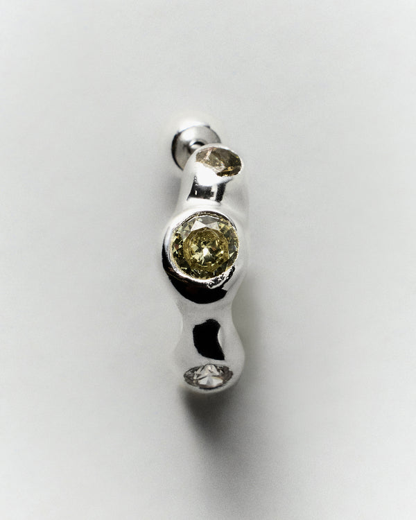 Tonka Hoops in silver: close-up of a hoop showing two pale green inset stones.