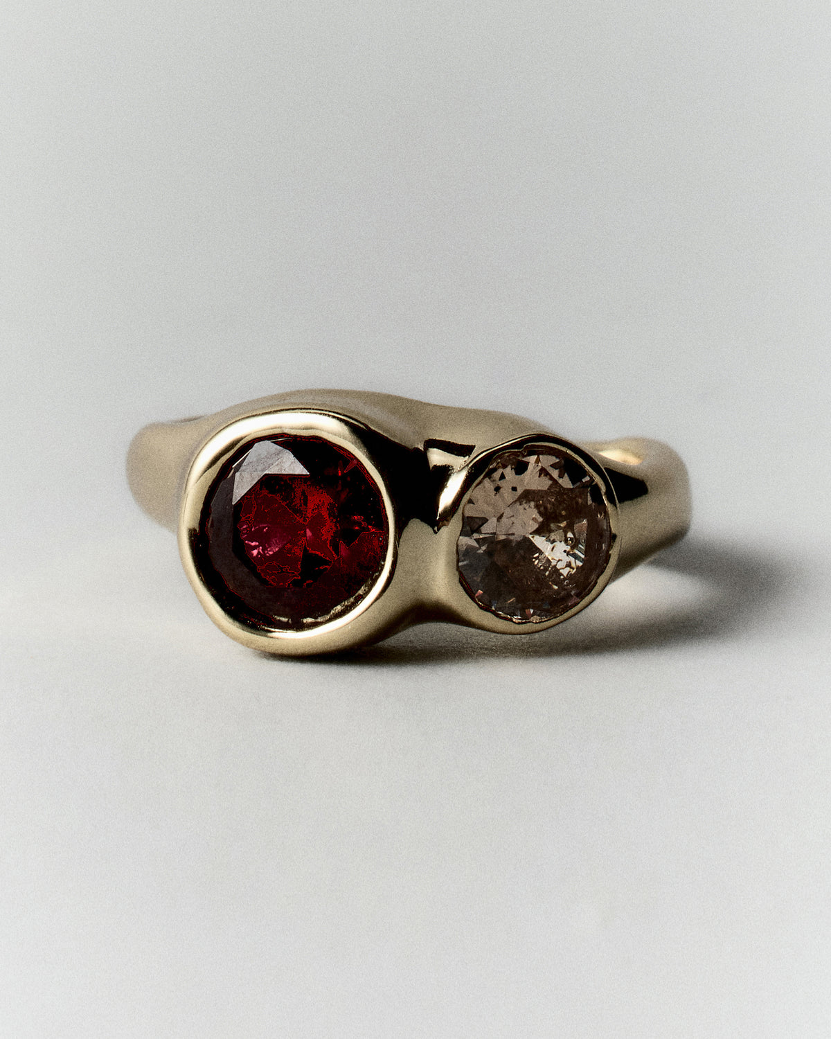 Tonka Ring in gold: front view of the ring's two rounded warm-colored stones.