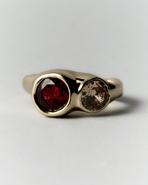 Tonka Ring in gold: front view of the ring's two rounded warm-colored stones.