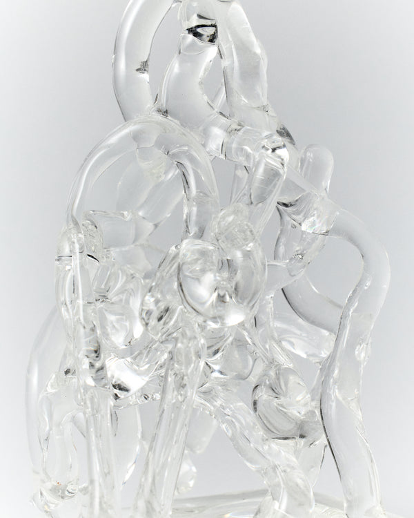 Watercousre Glass Candle Holder: close-up of the candle holder's flowing clear glass forms.